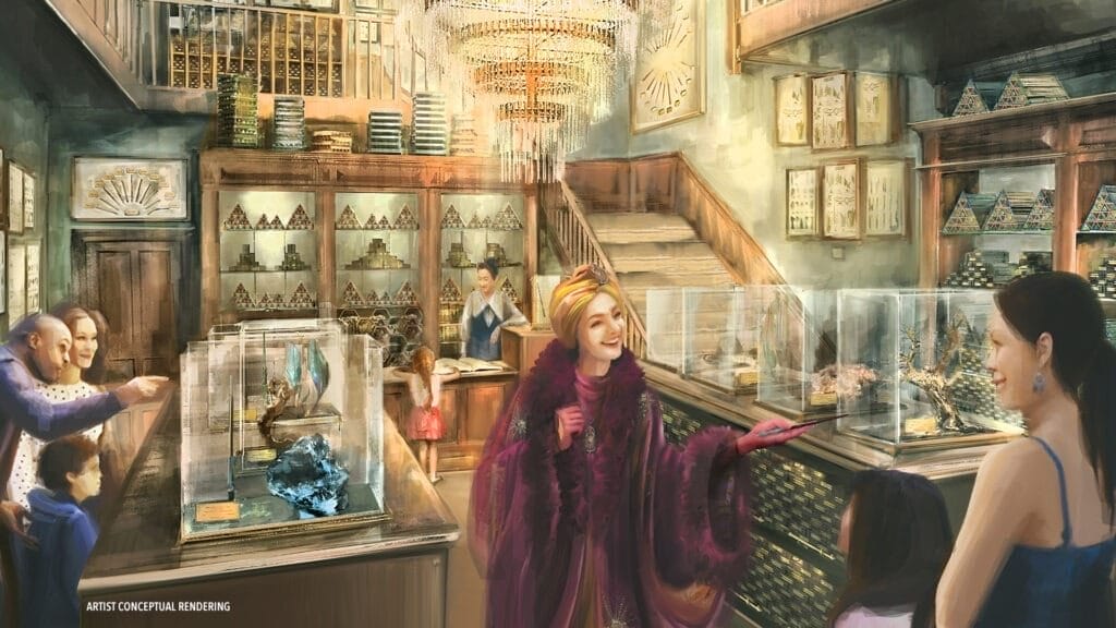 Artist's concept rendering of an ornate crystal shop within the Universal Epic Universe, with visitors admiring displays, a chandelier, and a staircase. A woman in a purple outfit interacts with patrons amidst celestial-themed decor.