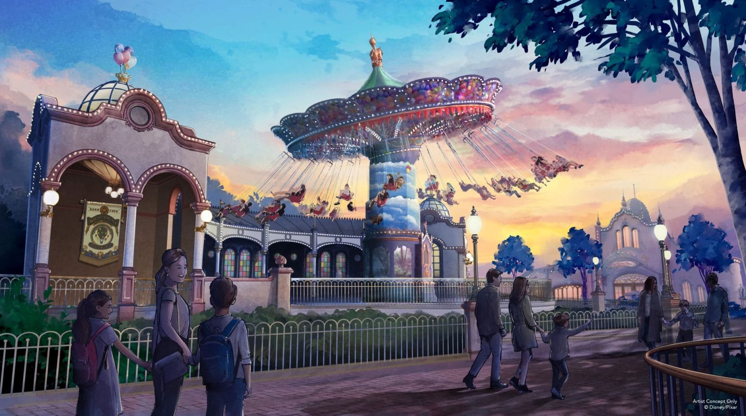 People walk near a carousel swing ride at an amusement park during sunset.