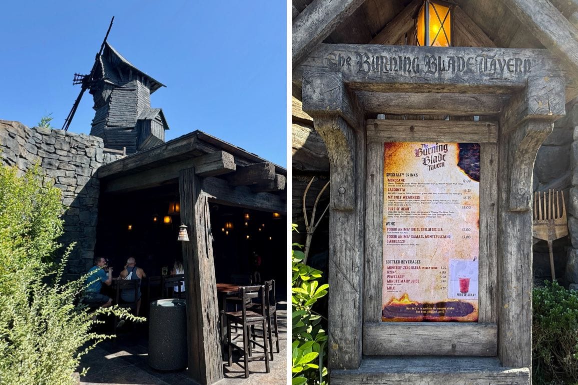 Outdoor dining at The Burning Blade Tavern, featuring rustic decor and a menu board under a charming wooden archway.