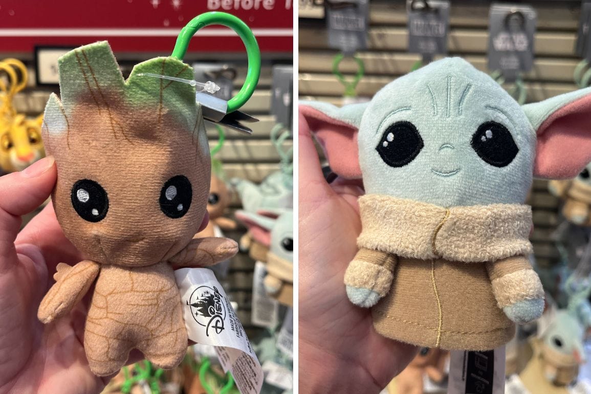 Two plush toys held in hand: left, a character shaped like a small tree; right, a character with green skin, large ears, and a brown robe. Both have tag labels attached and can double as whimsical keychains to accessorize your everyday essentials.