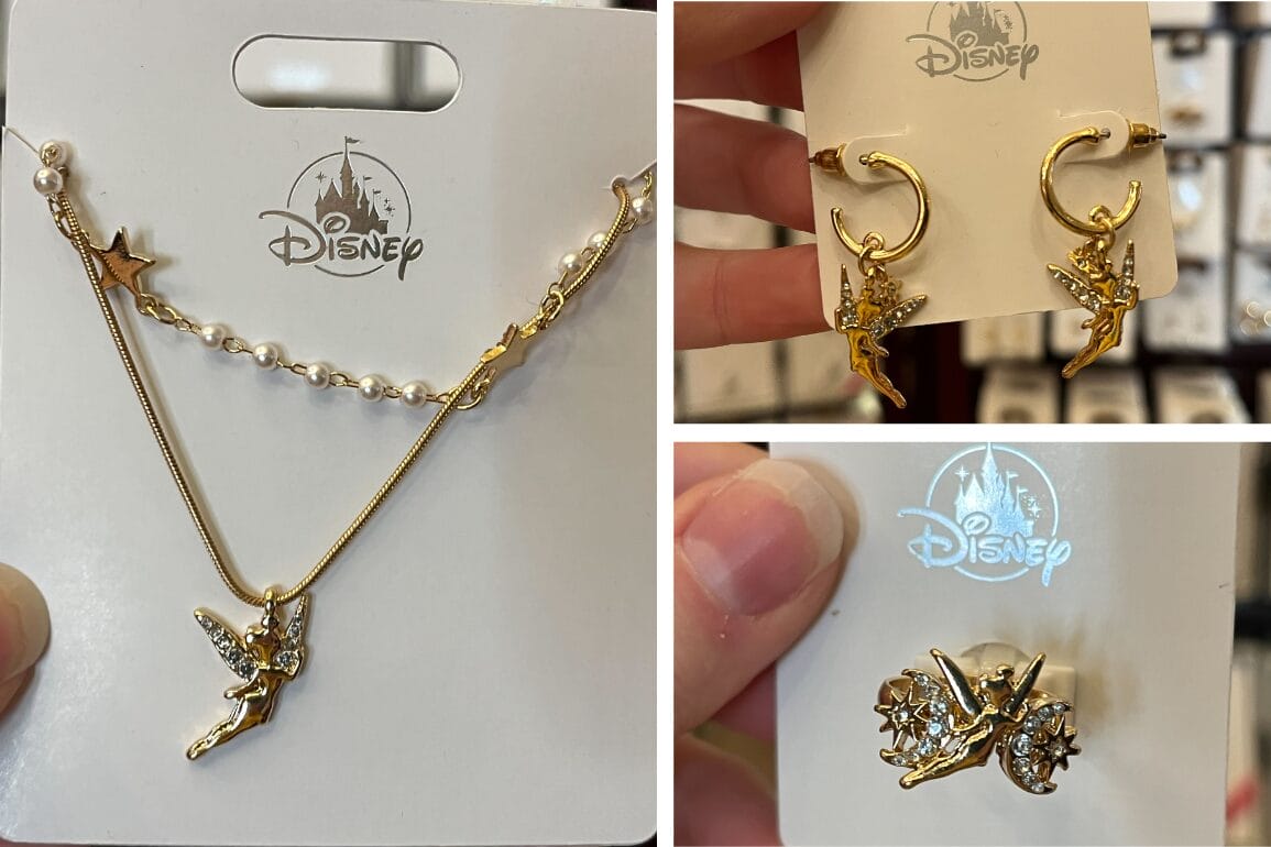 Discover the Gold Tinker Bell Jewelry set, available at the Emporium. This Disney collection includes a necklace and earrings with Tinker Bell charms and dangling star accents, all beautifully presented on a display card.