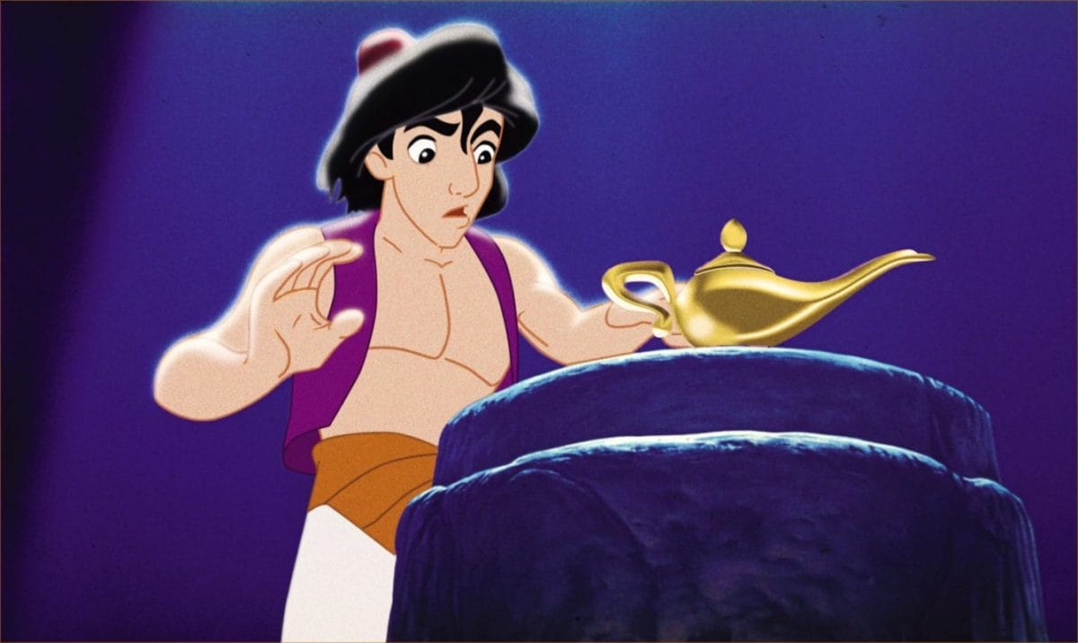 Animated Disney character Aladdin reaches toward a glowing golden magic lamp on a stone pedestal under a spotlight.