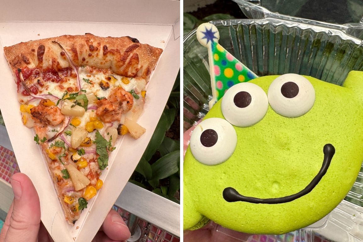 A hand holds a slice of Alien Pizza Planet pizza beside a green alien-shaped cookie wearing a party hat.