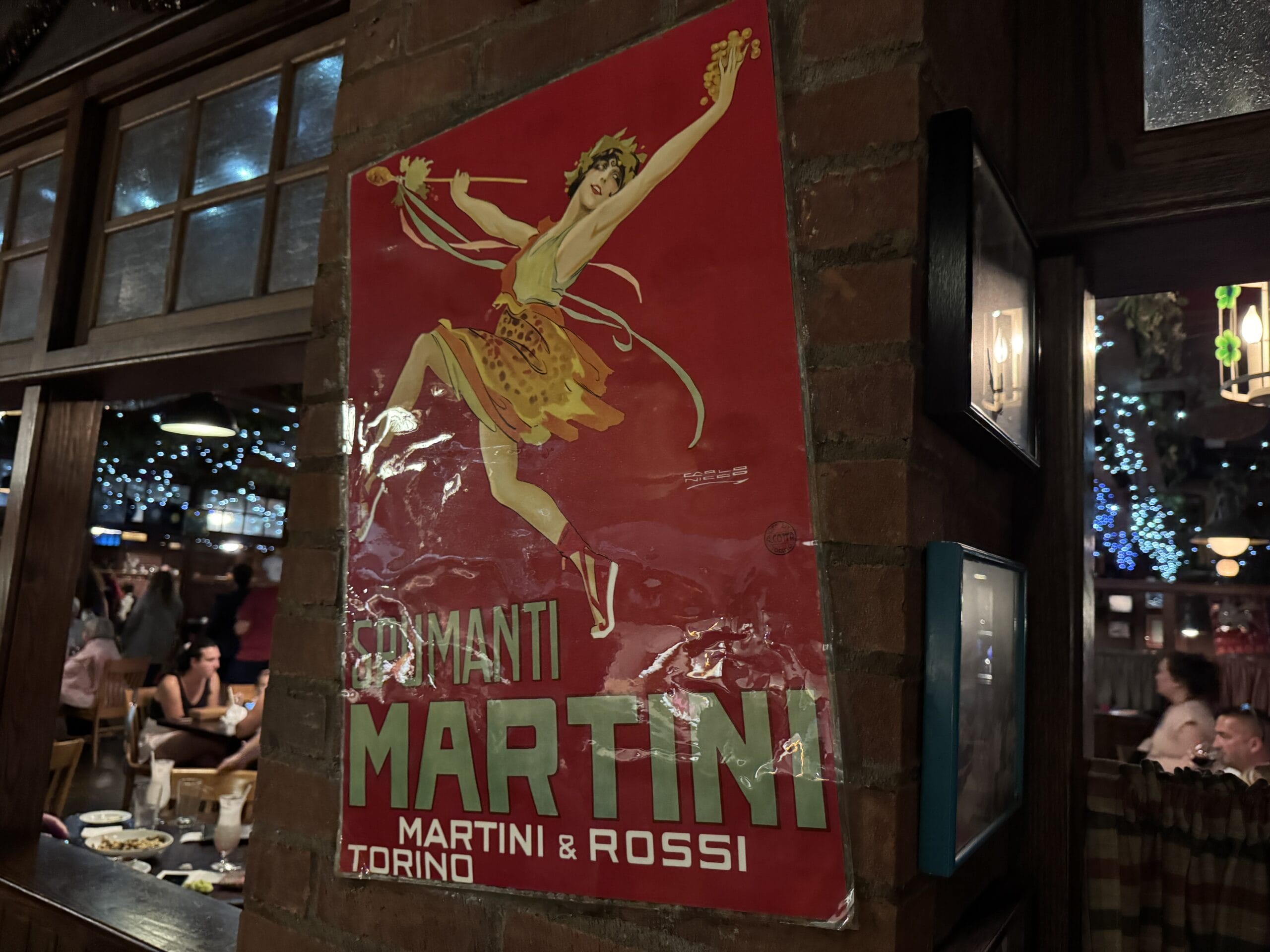 Vintage red “Martini” poster at Mama Melrose’s Ristorante Italiano in Disney's Hollywood Studios, perfect for photos.