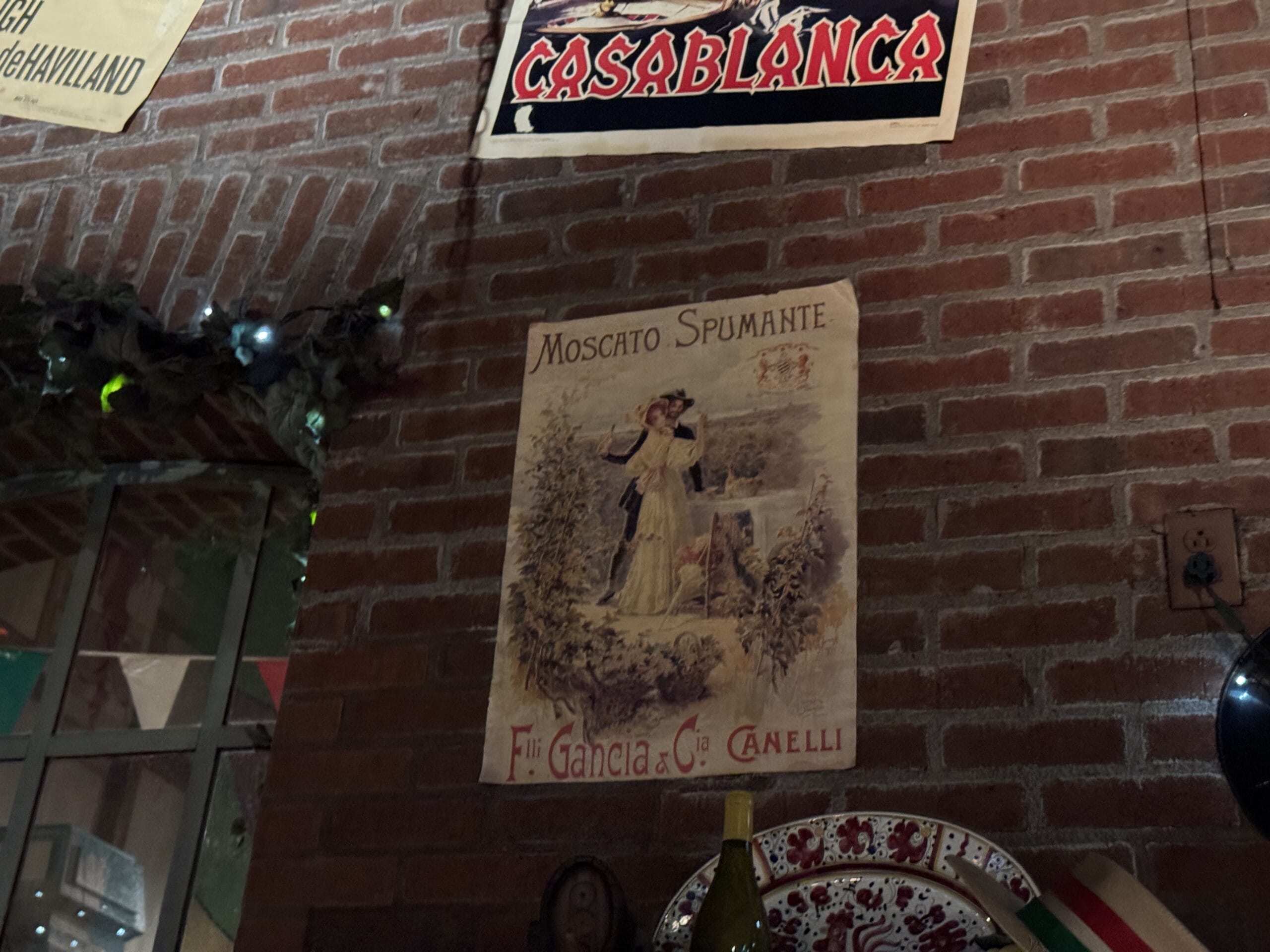 A vintage Moscato Spumante poster hangs at Mama Melrose’s Ristorante Italiano in Disney's Hollywood Studios.