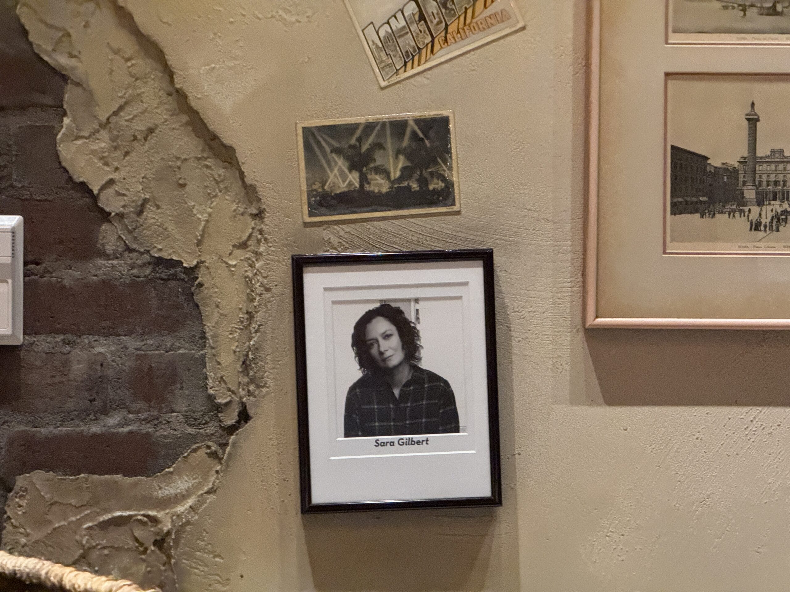 A framed black-and-white photo of “Sara Gilbert” hangs in Mama Melrose’s Ristorante Italiano at Disney's Hollywood Studios.