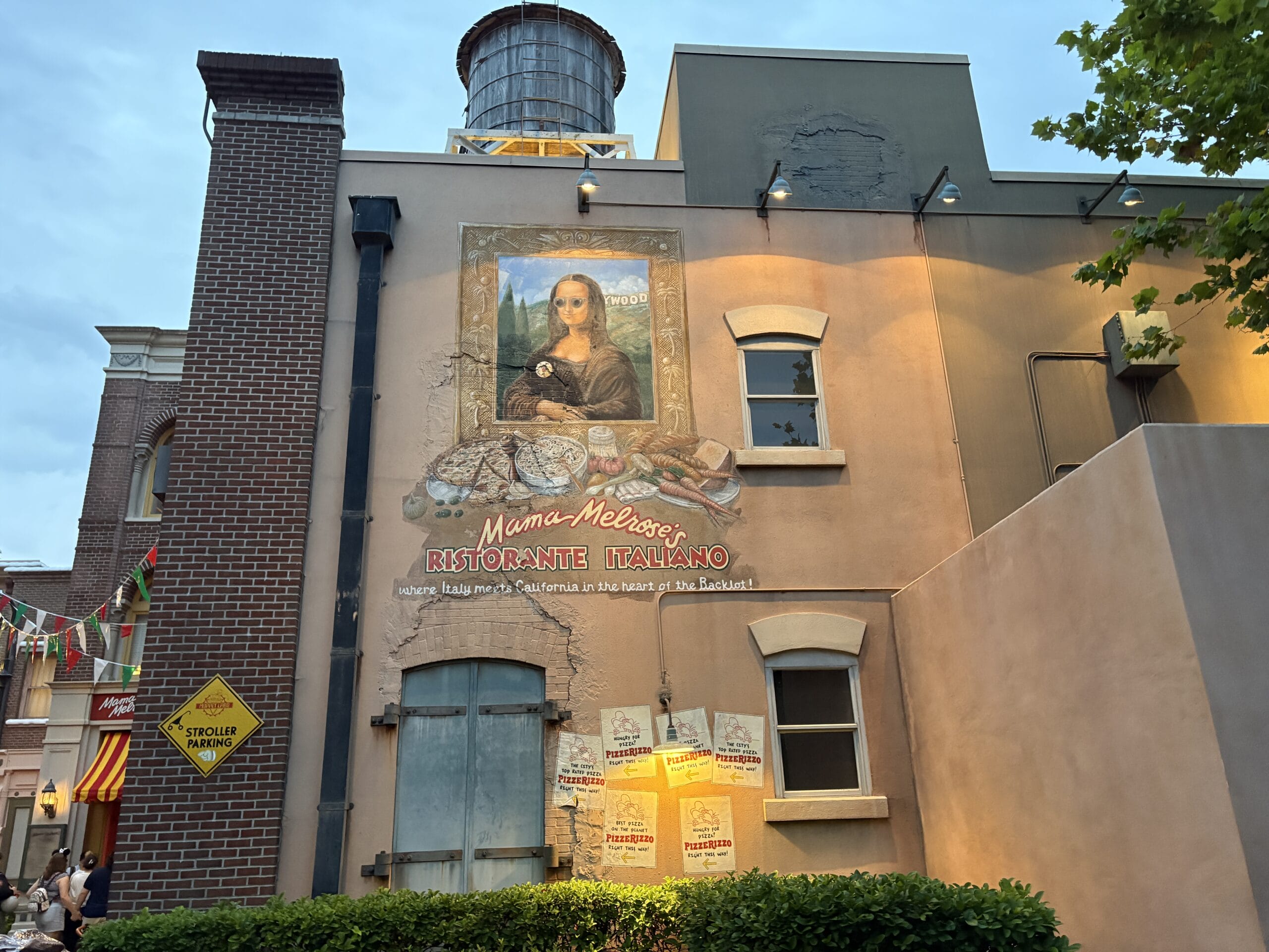 A wall mural of the Mona Lisa holding spaghetti at Disney's Hollywood Studios is perfect for photos at Mama Melrose&rsquo;s Ristorante Italiano.