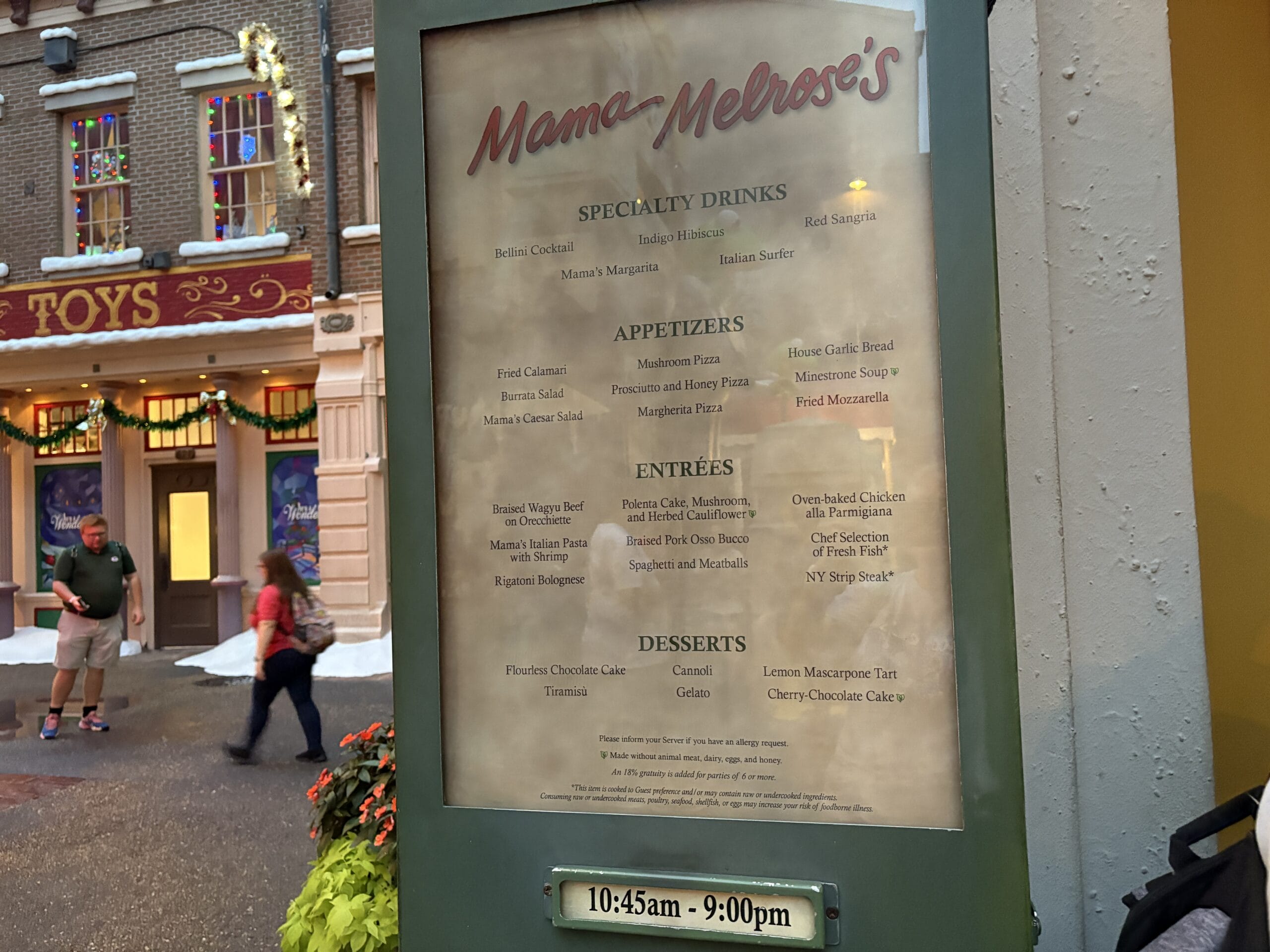 Mama Melrose’s Ristorante Italiano menu displayed outside at Disney's Hollywood Studios, listing specialty food and drinks.