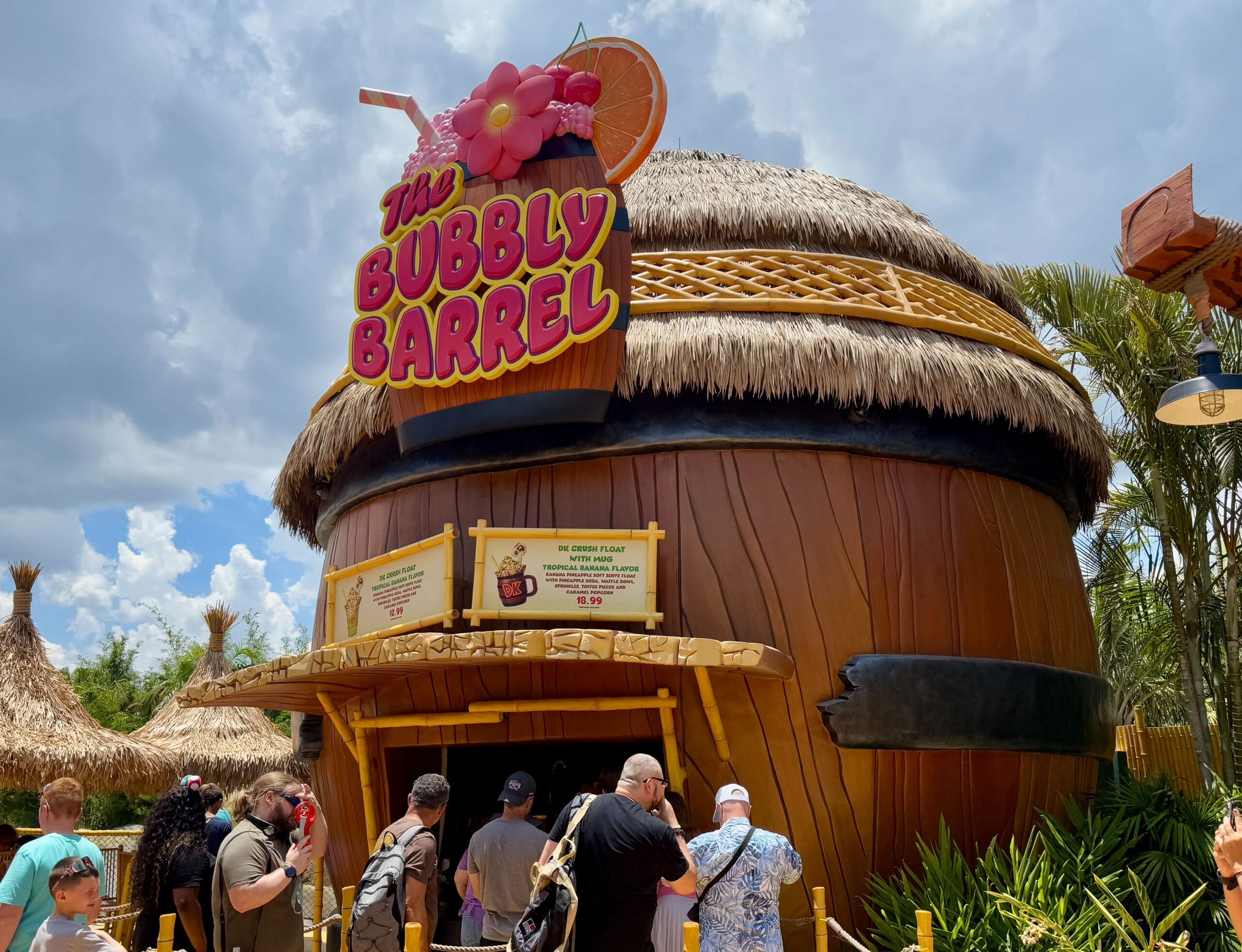 People wait in line at The Bubbly Barrel for a dk crush float, a tropical treat at Super Nintendo World’s Epic Universe.