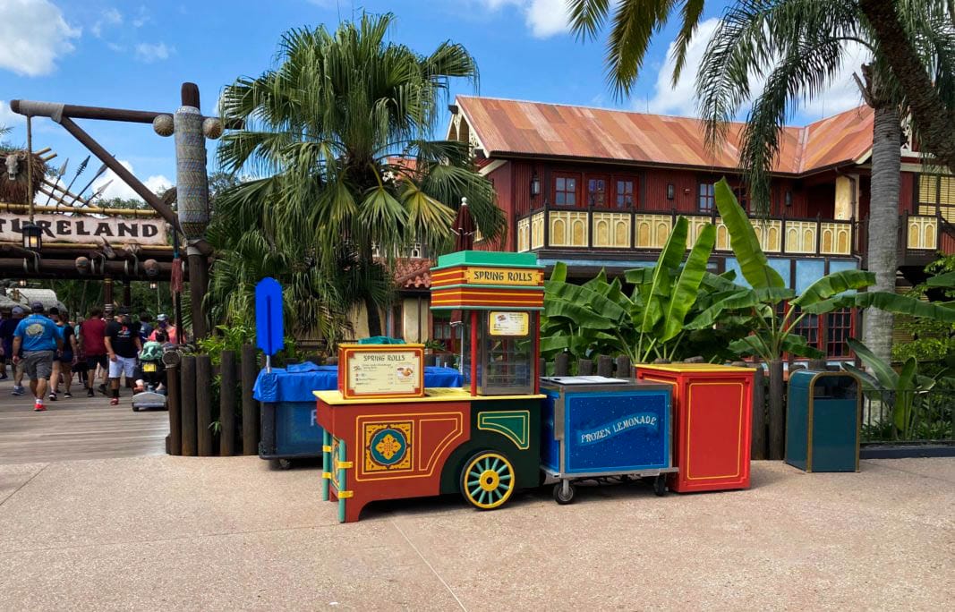 Colorful spring roll cart near tropical plants in Adventureland