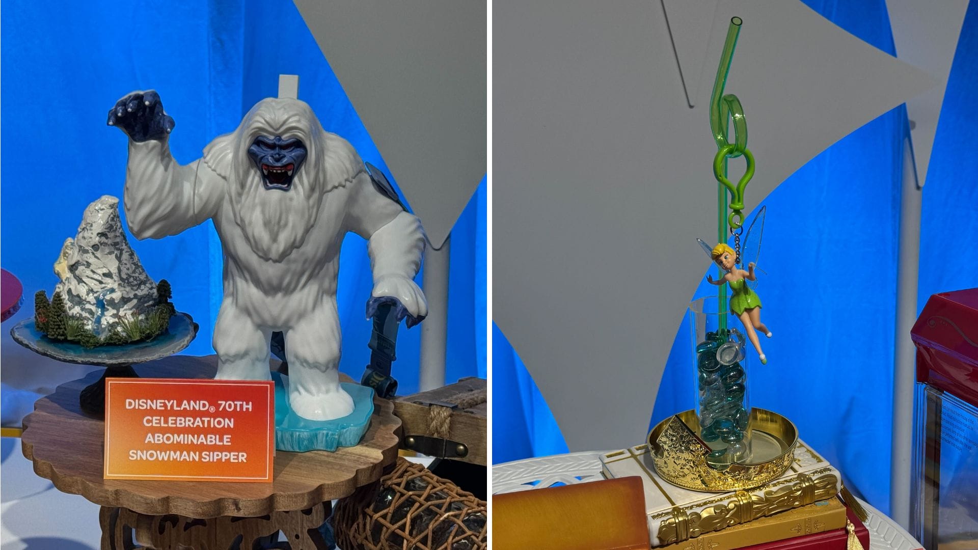 A white Harold the Yeti Sipper and green Tinker Bell straw—fun Disneyland souvenirs with Disneyland signs on display.
