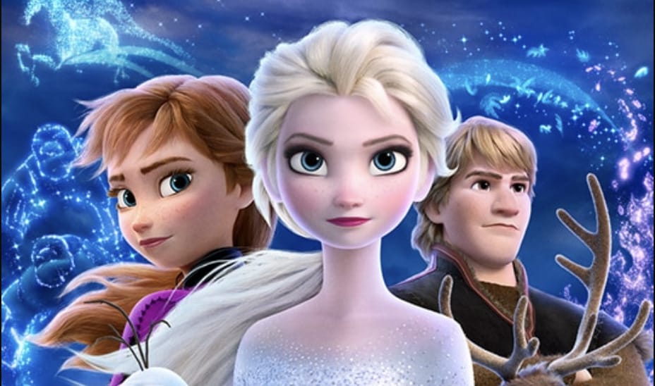 Three Disney characters Elsa, Anna and Kristoff stand together before a magical icy backdrop with swirling blue lights and snowflakes.
