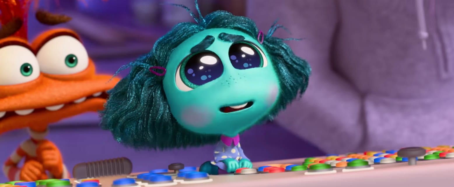 Envy from Inside Out 2 sits at a colorful control panel