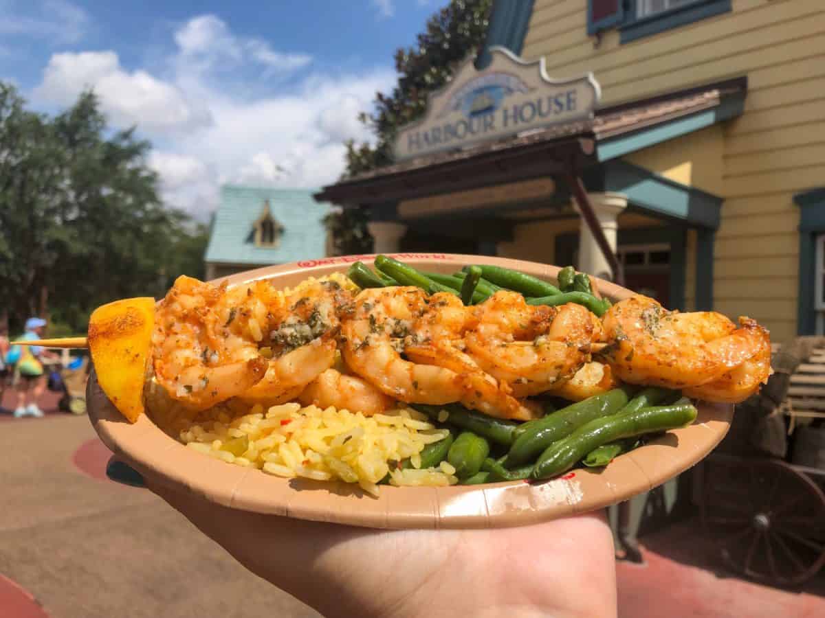 A plate of grilled shrimp, rice, and green beans outside Liberty Square’s Harbour House restaurant.
