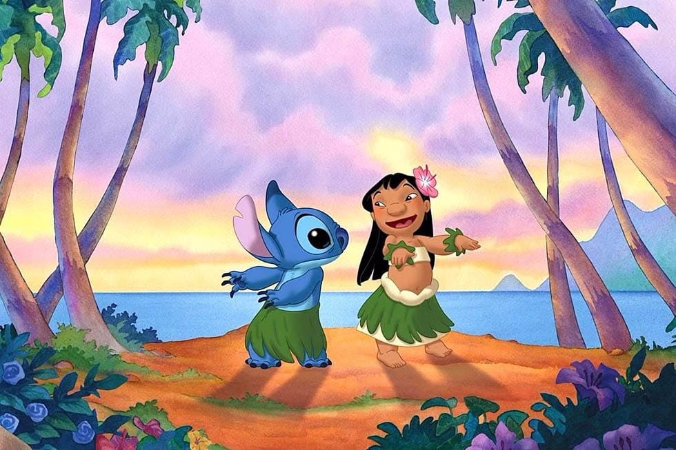 Disney Characters Lilo and Stitch wear grass skirts and dance joyfully on a tropical beach at sunset, surrounded by palms.