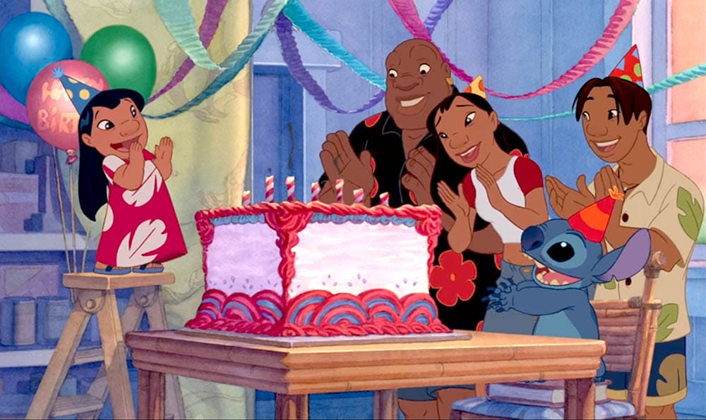 Animated characters celebrate a birthday with cake and party hats—perfect for Stitch Wallpaper free downloads.