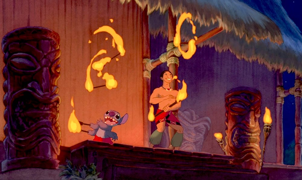Animated characters perform a fire dance at night, surrounded by tiki statues—perfect for Stitch Wallpaper or Free Downloads.