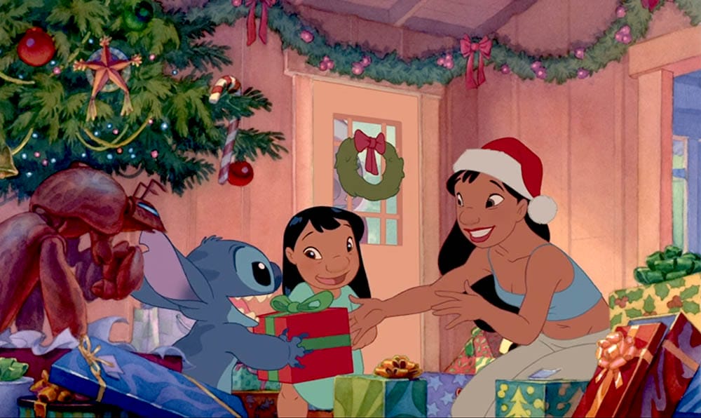 Animated characters under a Christmas tree exchanging gifts, perfect as a Stitch wallpaper with free downloads available.