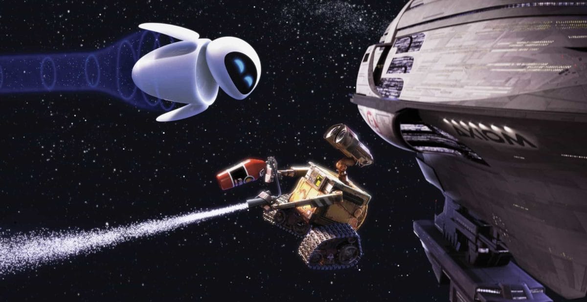 Eve and Wall-e, Disney characters, float in space near a large spaceship and stars.