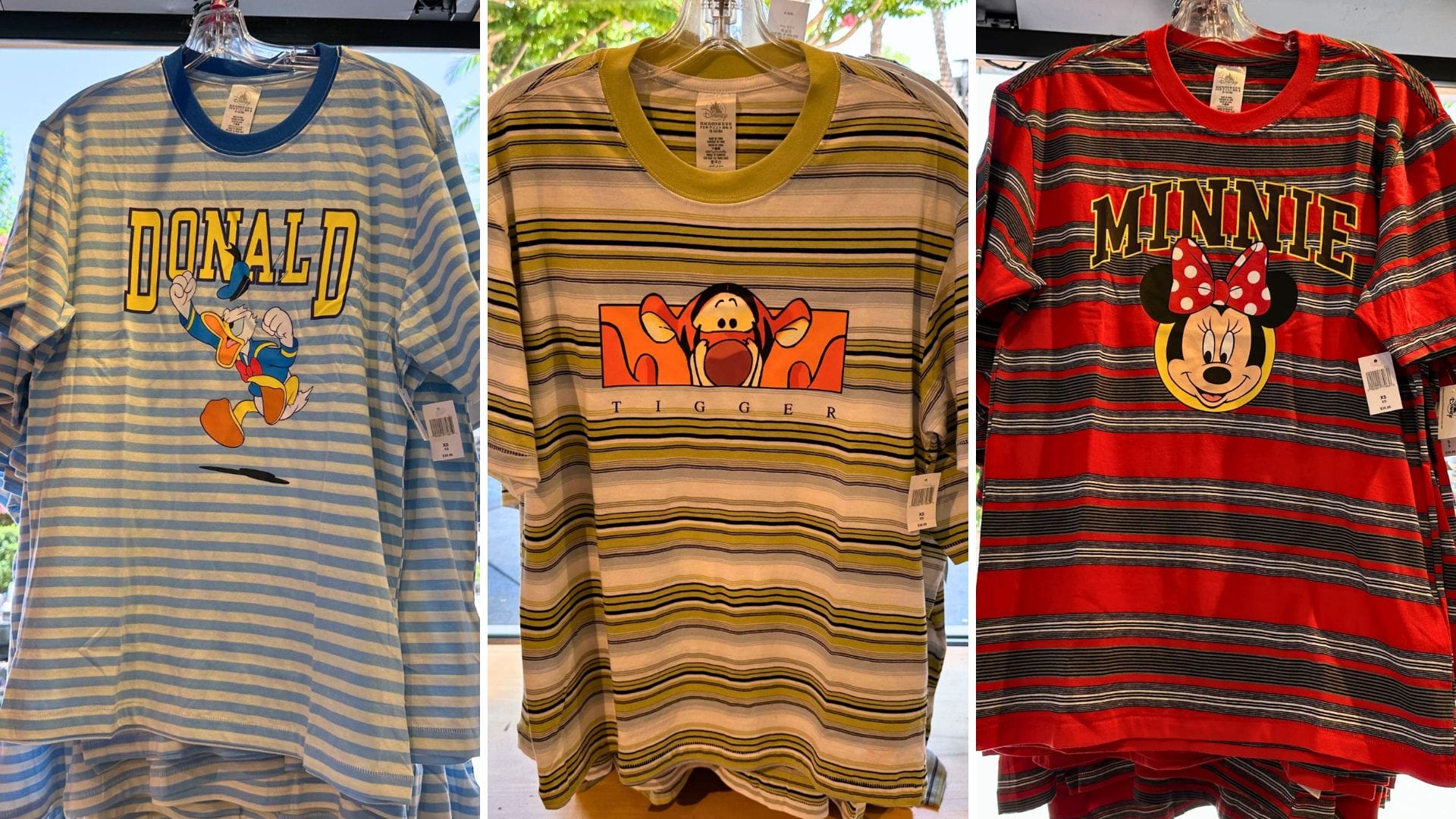 Striped Character T-Shirts featuring Donald Duck, Tigger, and Minnie Mouse on display—perfect Disney shirts for any fan.
