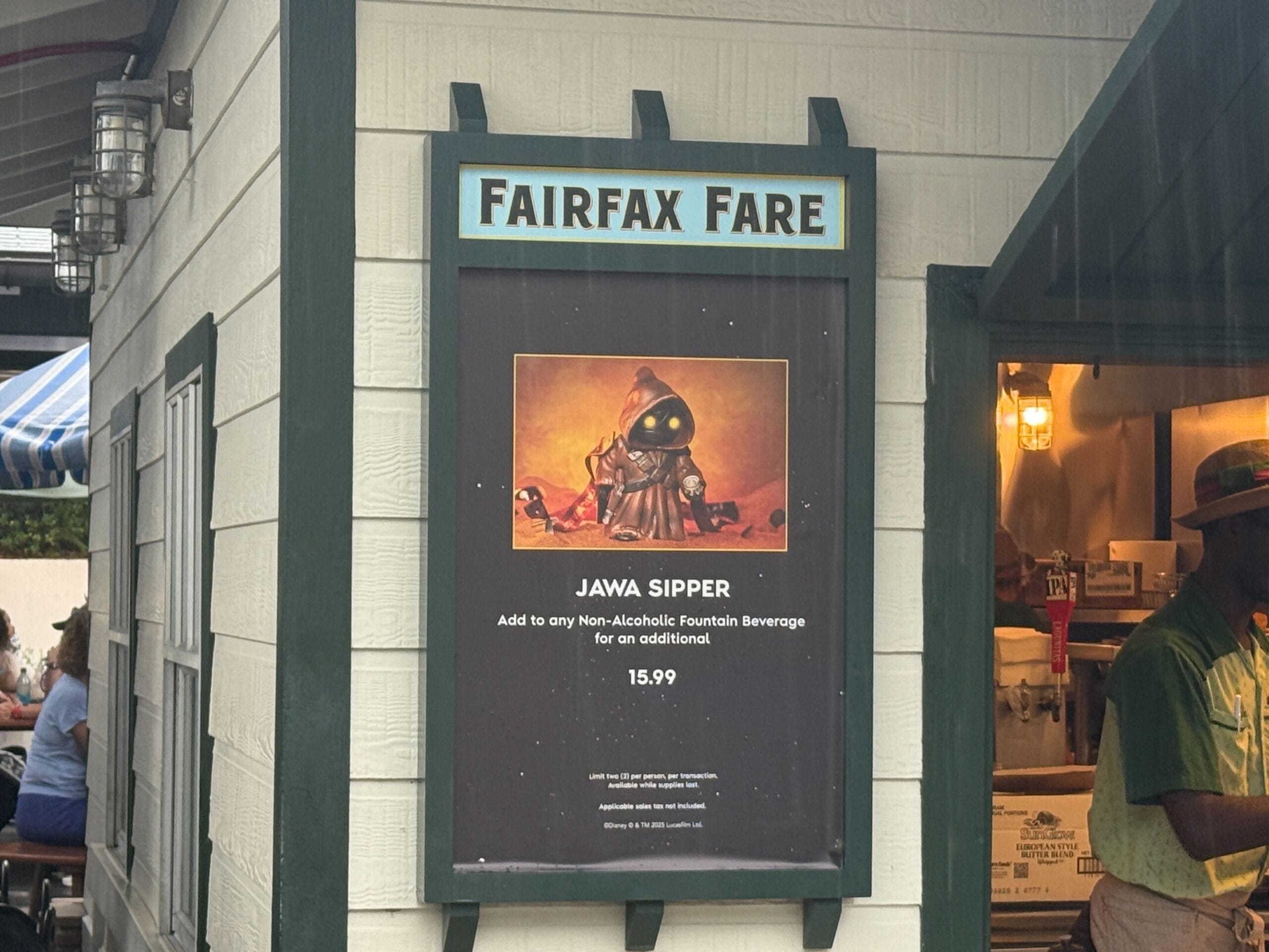 A sign at Fairfax Fare advertises a Jawa Sipper drink vessel for $15.99, featuring a picture of a Jawa.