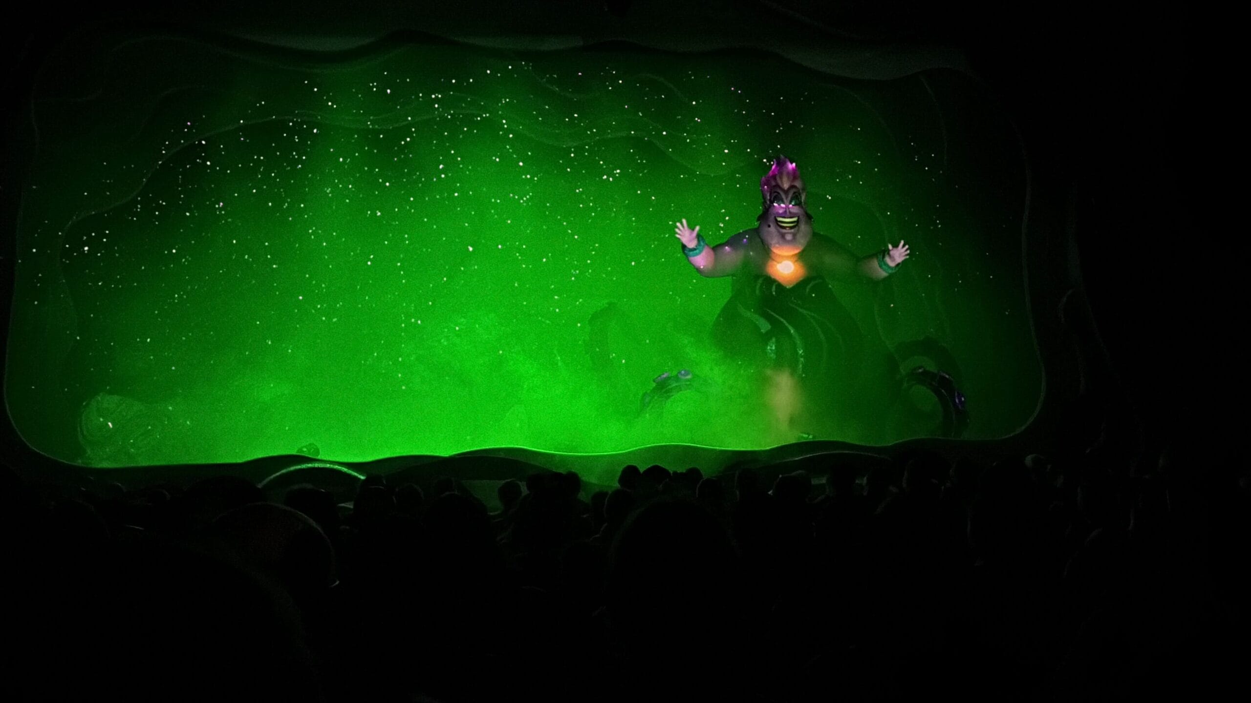 A villainous sea witch puppet with glowing eyes haunts the stage in Little Mermaid: A Musical Adventure.
