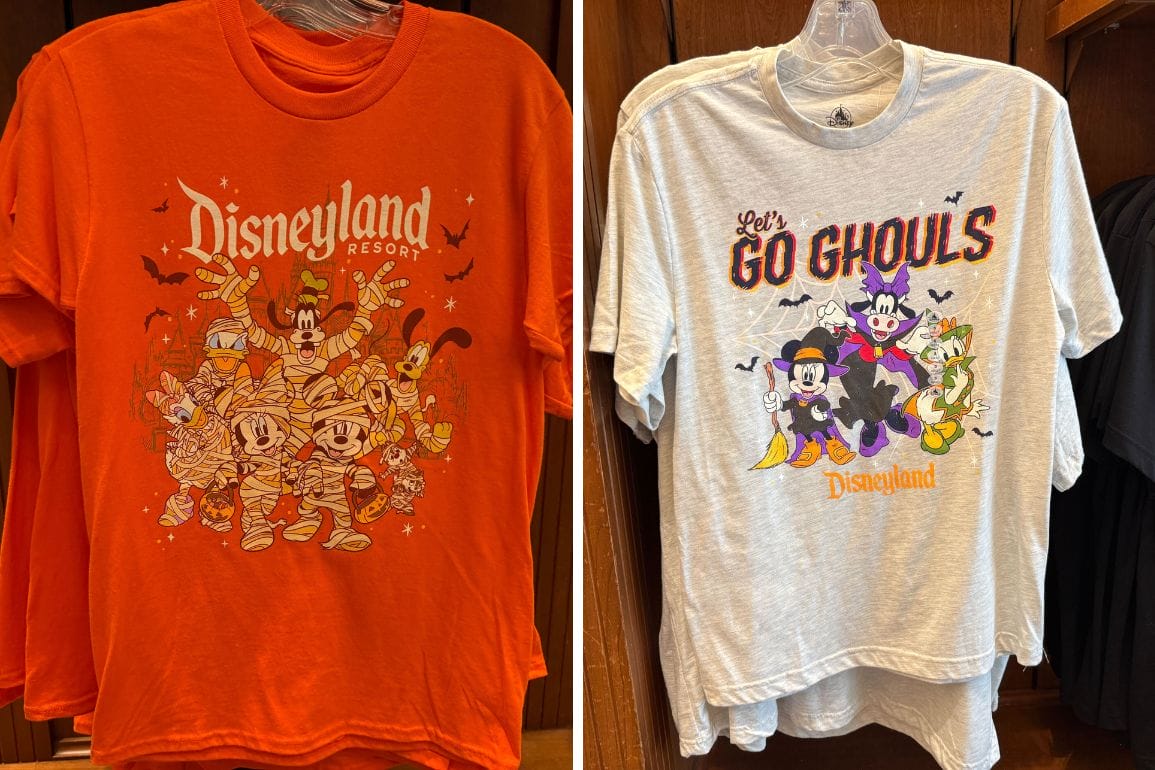 Two Disneyland Resort 2025 Halloween Merchandise shirts with Disney characters in costumes; orange and light gray on hangers.