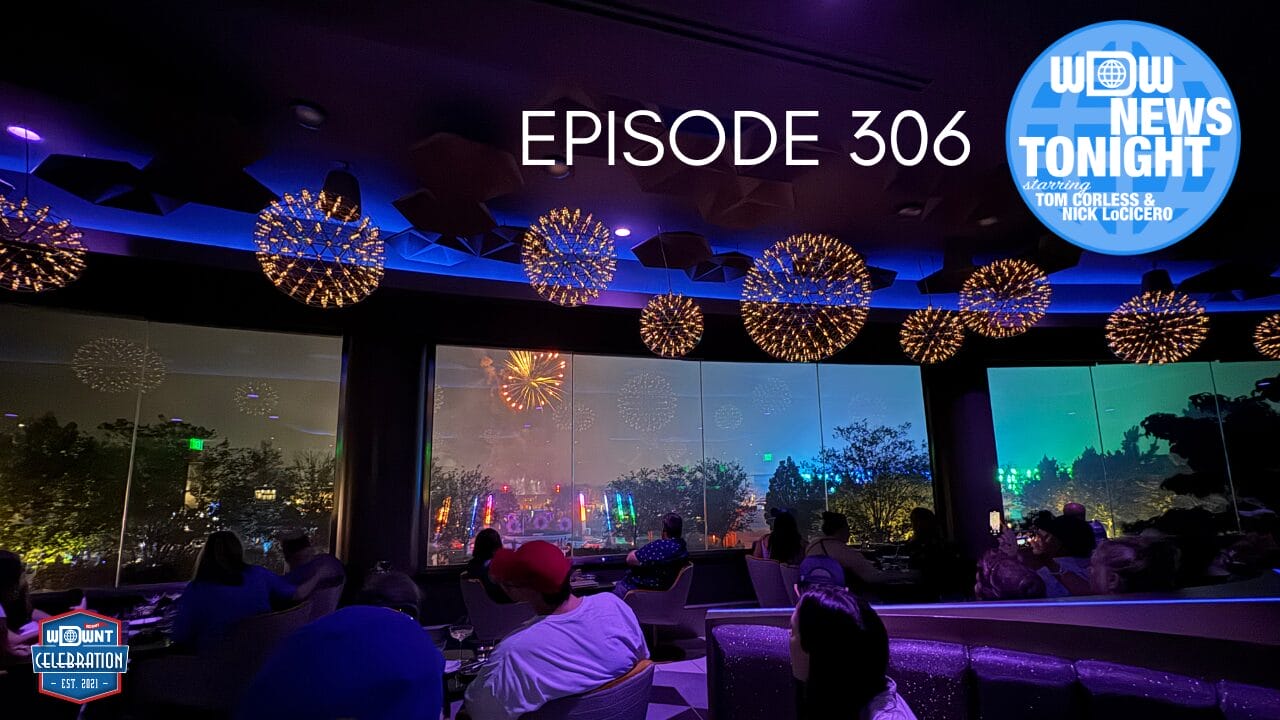 People watch colorful fireworks through large windows in a modern restaurant at Disney Parks with glowing ceiling lights.