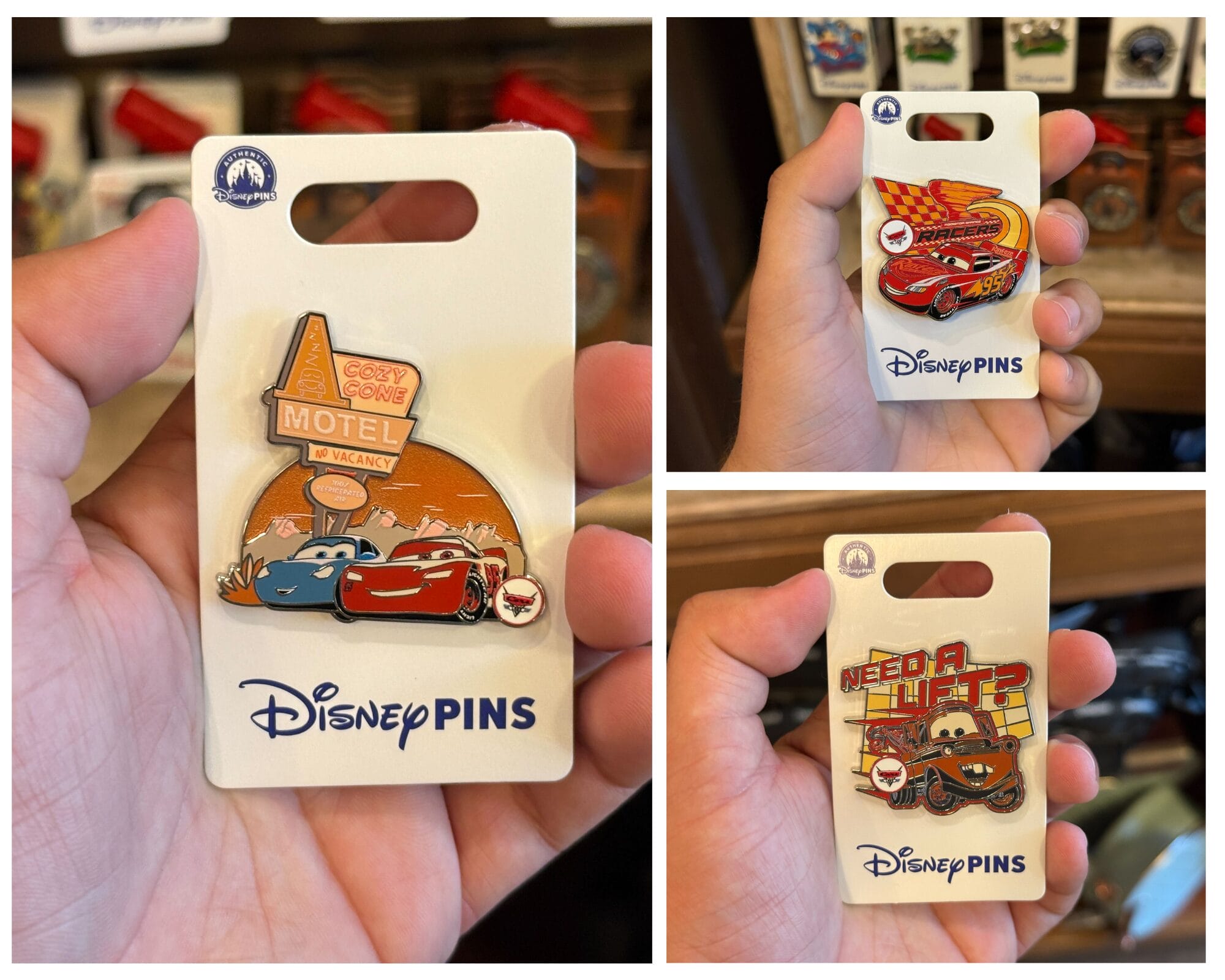 A hand holds Disney "Cars" pins, featuring Cars Land icons like Lightning McQueen, Mater, and Cozy Cone Motel.