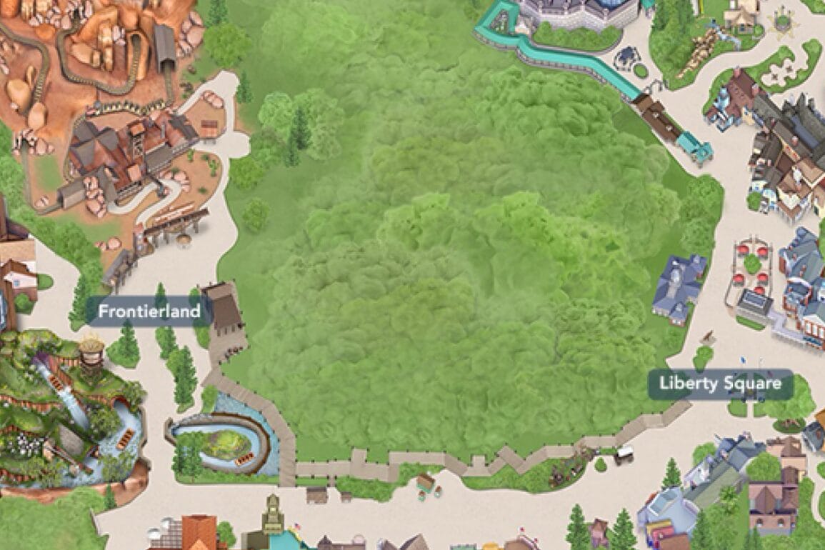 Map view with Rivers of America in Frontierland, Liberty Square on the right, and lush trees center stage.