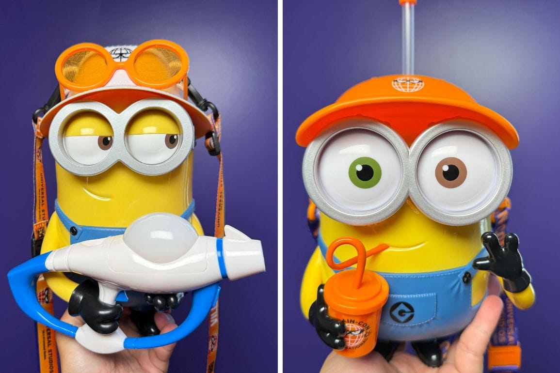 Two toy Minions wear orange hats and goggles, one holding a blue water blaster, the other a Universal Studios Japan drink bottle.
