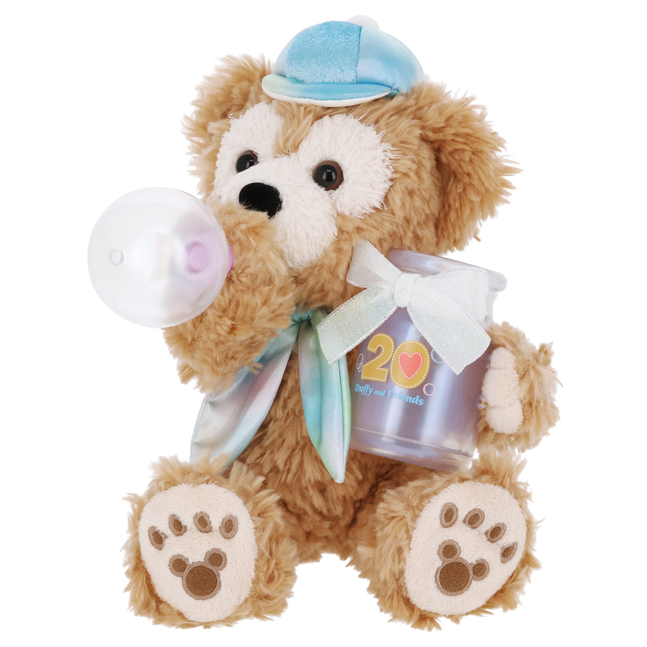 Plush Duffy the Disney Bear in a blue cap, holding a bottle and "20" jar, with a ribbon around its neck.