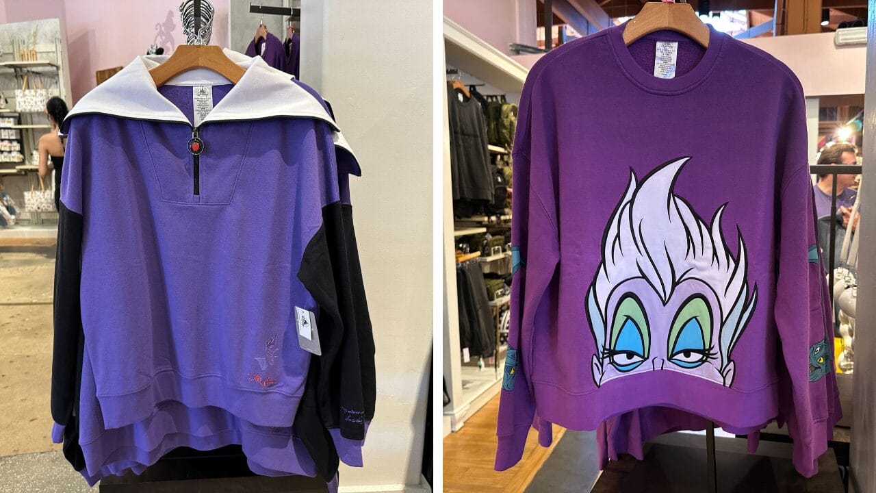 Side-by-side photo of Ursula and Evil Queen sweatshirts on display at a Disney World clothing store.