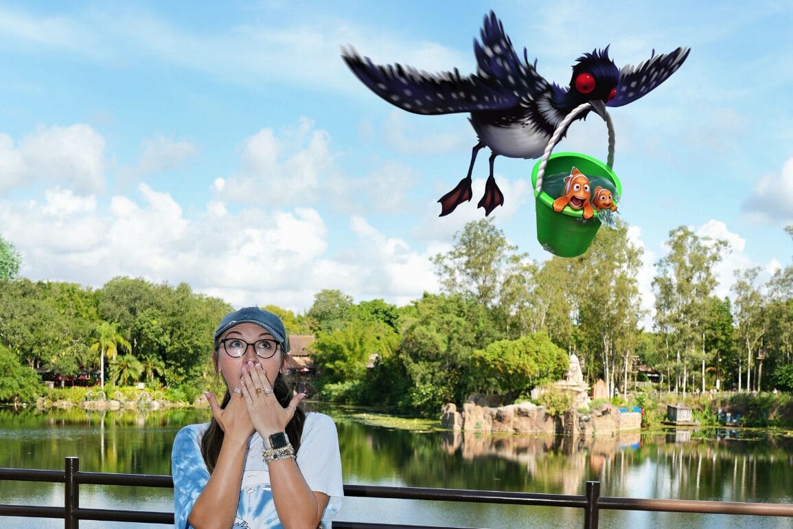 A surprised woman at Animal Kingdom watches as an animated bird steals a green bucket in this Passholder Exclusive Magic Shot.