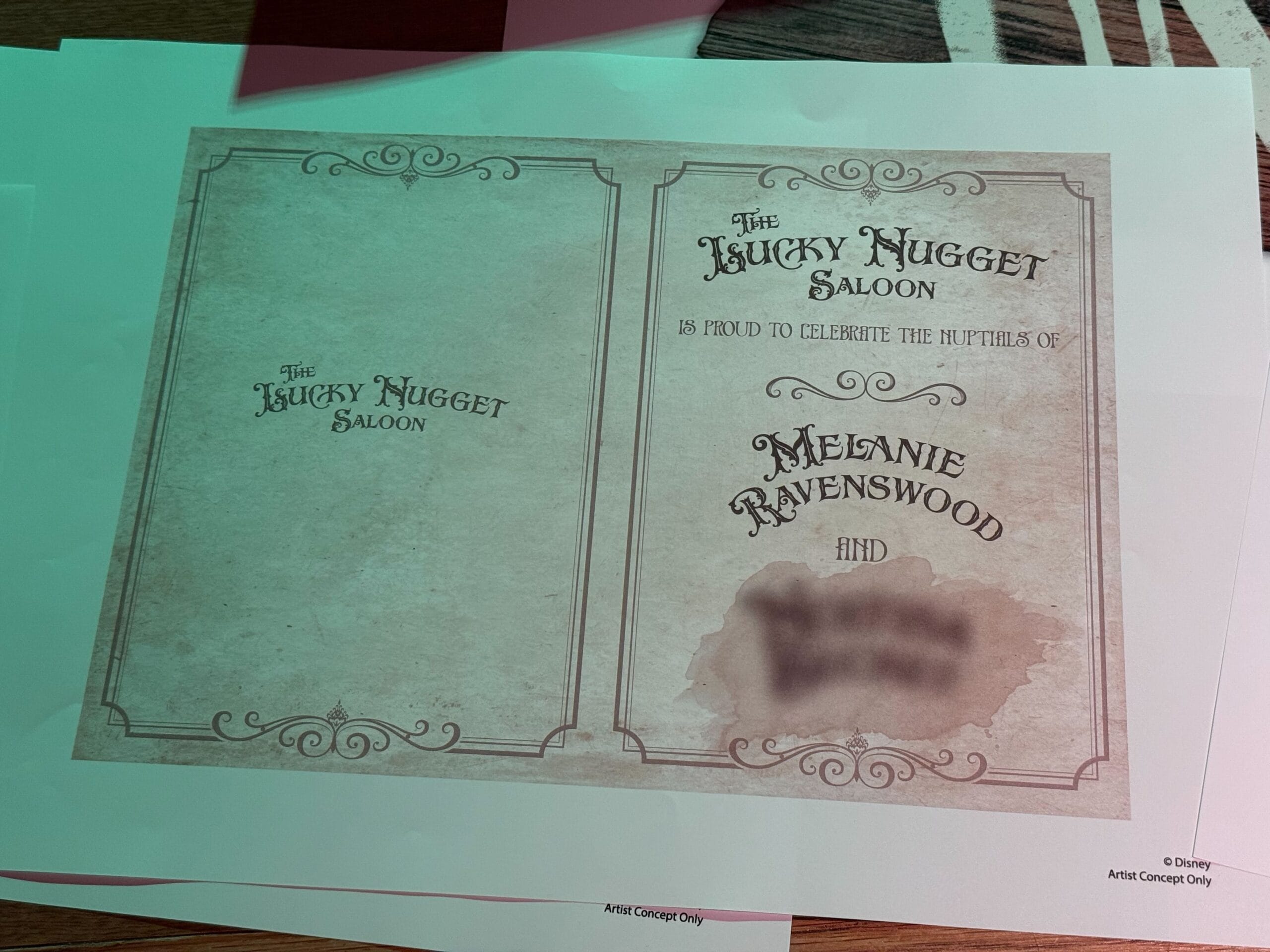 A printed sign for The Lucky Nugget Saloon at Disneyland Paris celebrating Melanie Ravenswood’s nuptials.