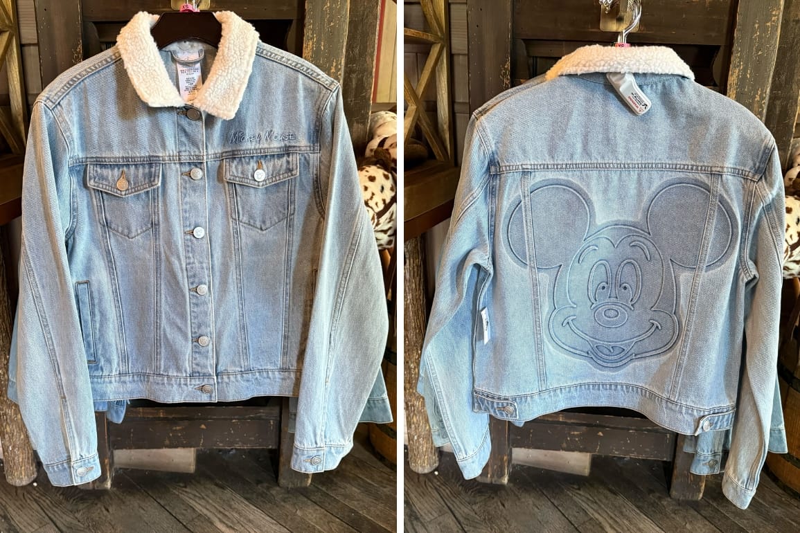 Light blue denim jacket with sherpa collar; front has buttons, back features large stitched Mickey Mouse face.