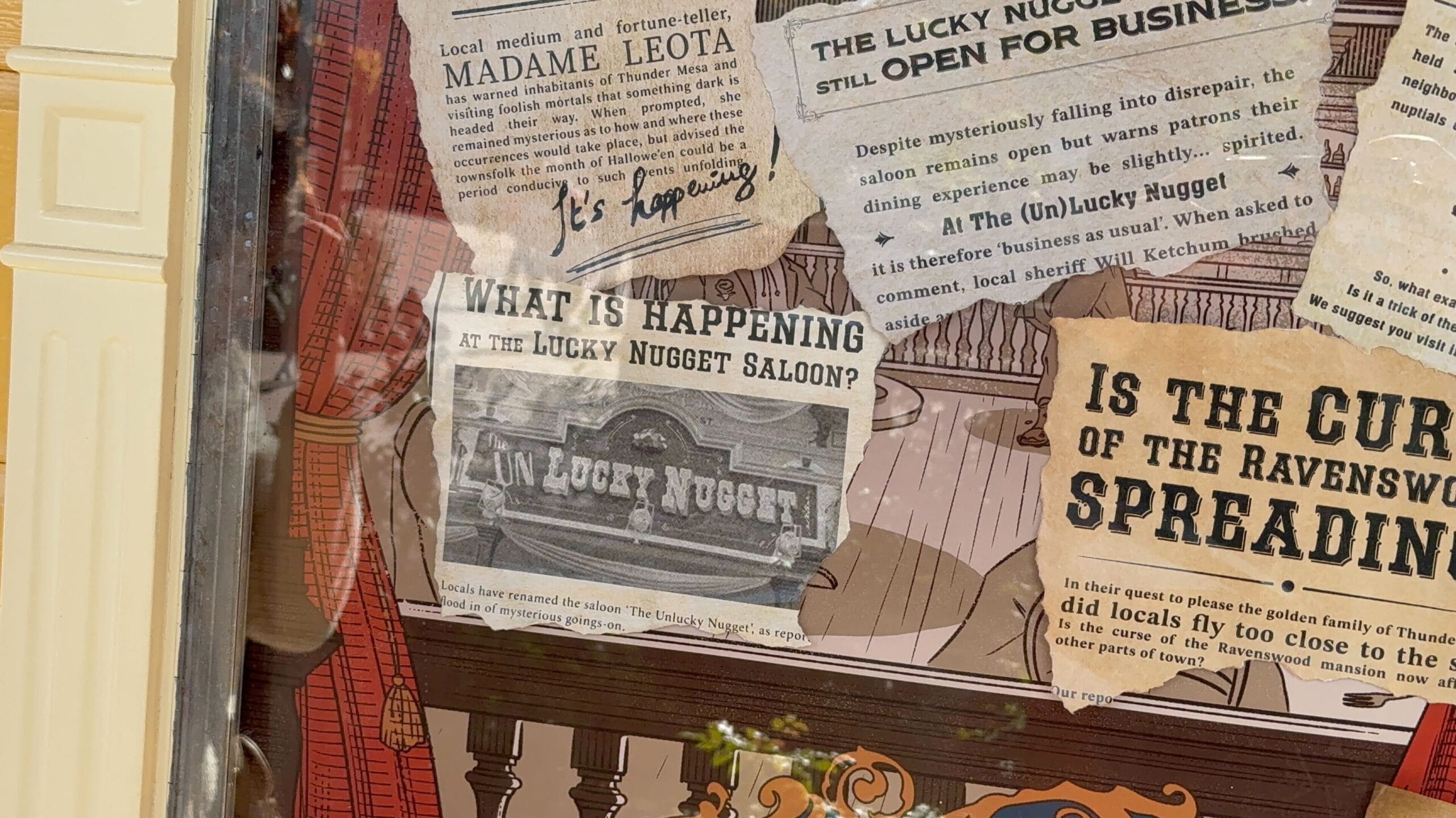 A collage of old clippings about the Unlucky Nugget Saloon near Phantom Manor, with headlines and handwritten notes.