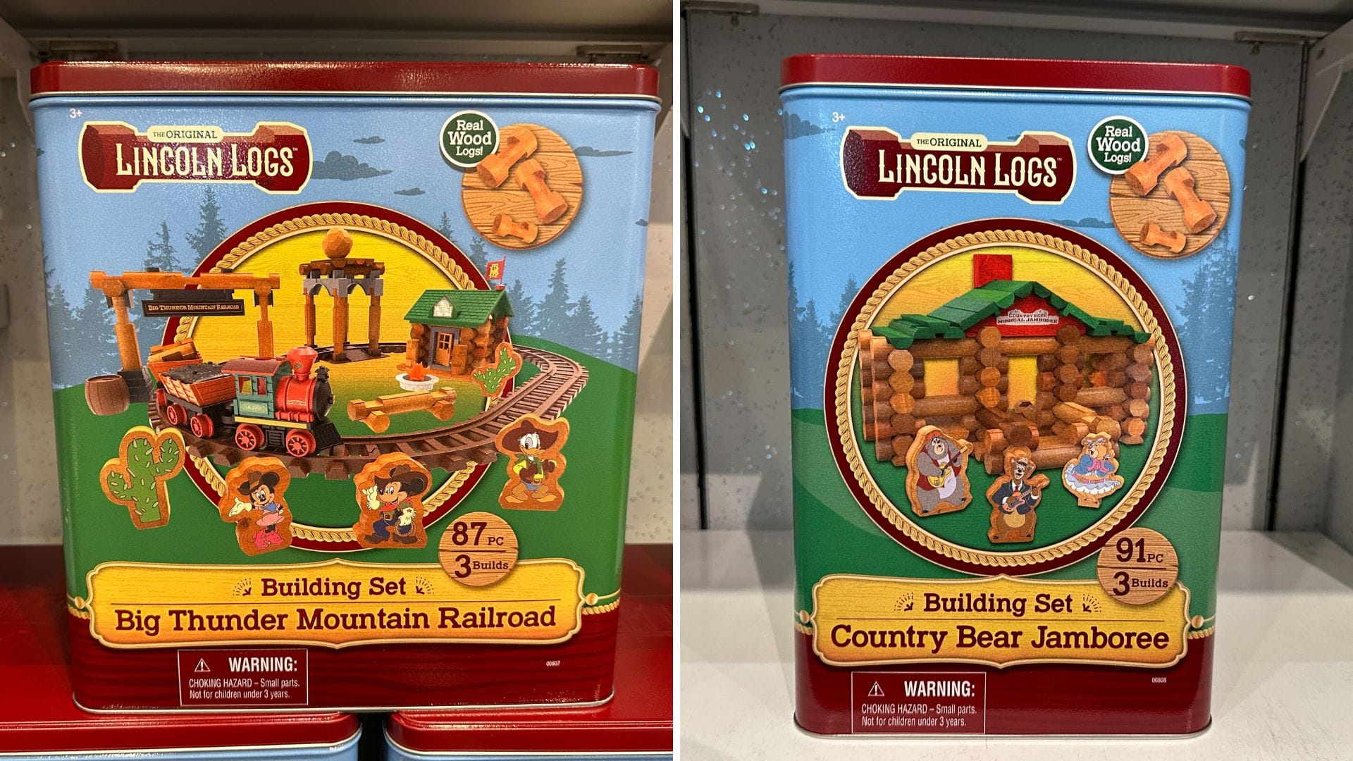 Two Lincoln Logs tins: one for "Big Thunder Mountain Railroad," the other for "Country Bear Jamboree" building sets.