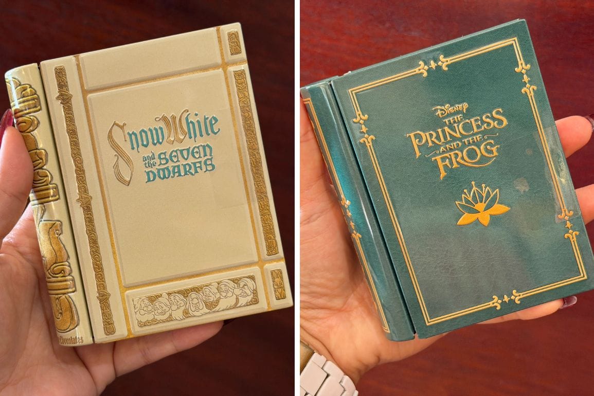 Two hands hold Disney Parks Story Book Souvenir Tins for "Snow White" and "The Princess and the Frog," filled with chocolates.