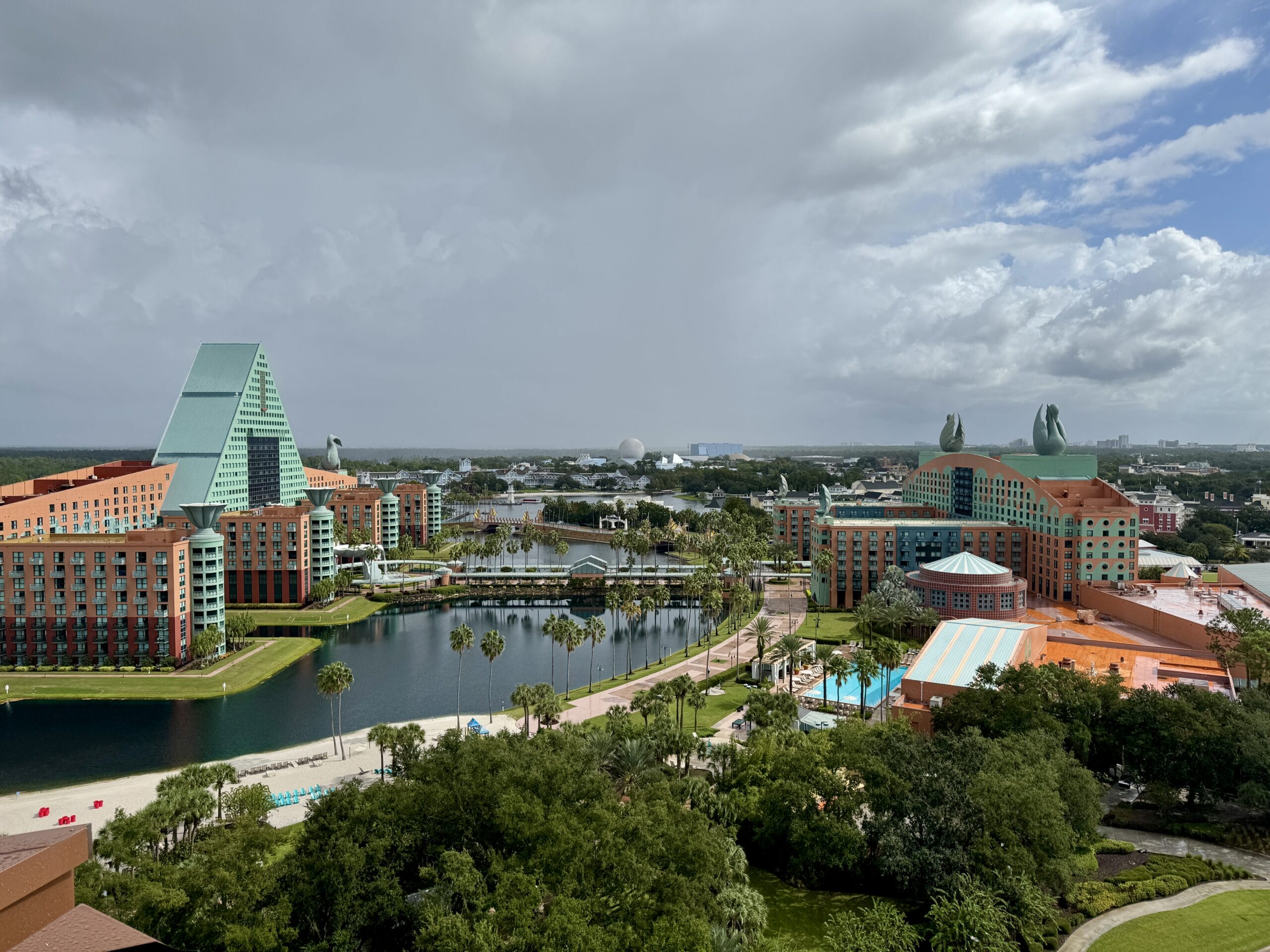 First Look: Aerial view of Swan and Dolphin Resort by a lake, home to Orlando’s Food & Wine Classic.