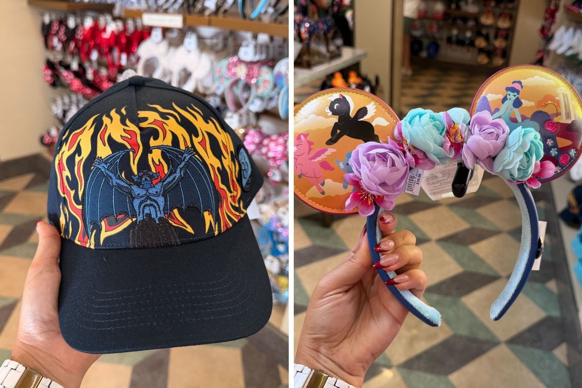 A hand holds Disney Parks headwear: a black hat with bat and flames, plus a floral Fantasia 85th Anniversary headband. No castle visible.