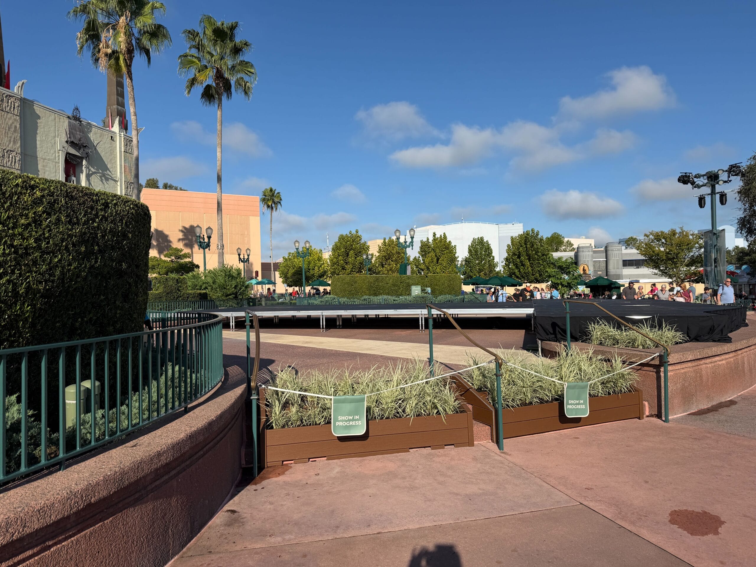 A roped-off section with planters and a covered platform at Disney’s Hollywood Studios, ready for Jollywood Nights festivities.