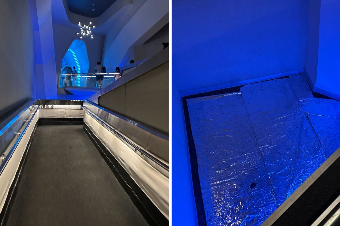 A moving walkway and a foil-covered, blue-lit area call to mind Space Mountain at Disney World, echoing its Tomorrowland style.