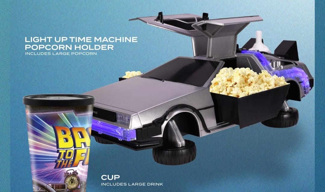 A DeLorean-shaped popcorn bucket filled with popcorn is next to a Back to the Future 40th Anniversary cup, no Disney castle visible.