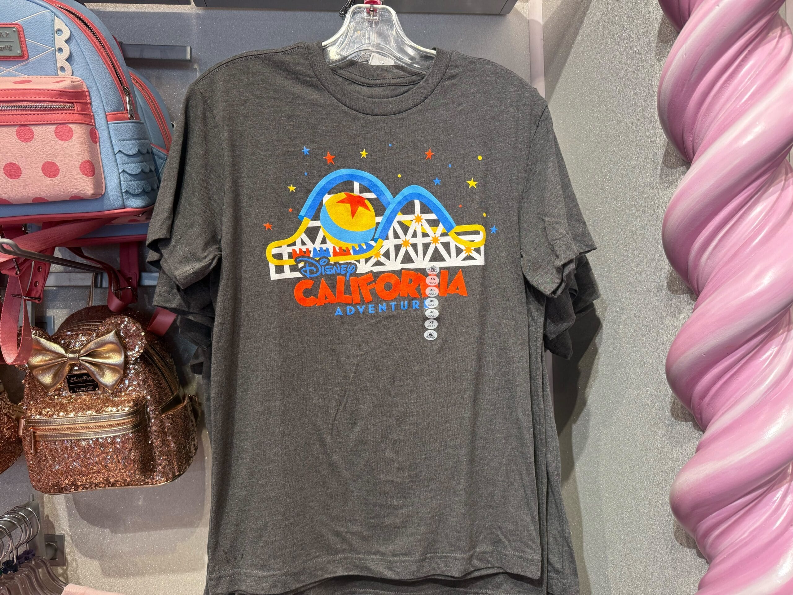 Gray Disney California Adventure T-shirt featuring a vibrant graphic of Pixar Pier’s coaster, ferris wheel, and fireworks—not a castle.