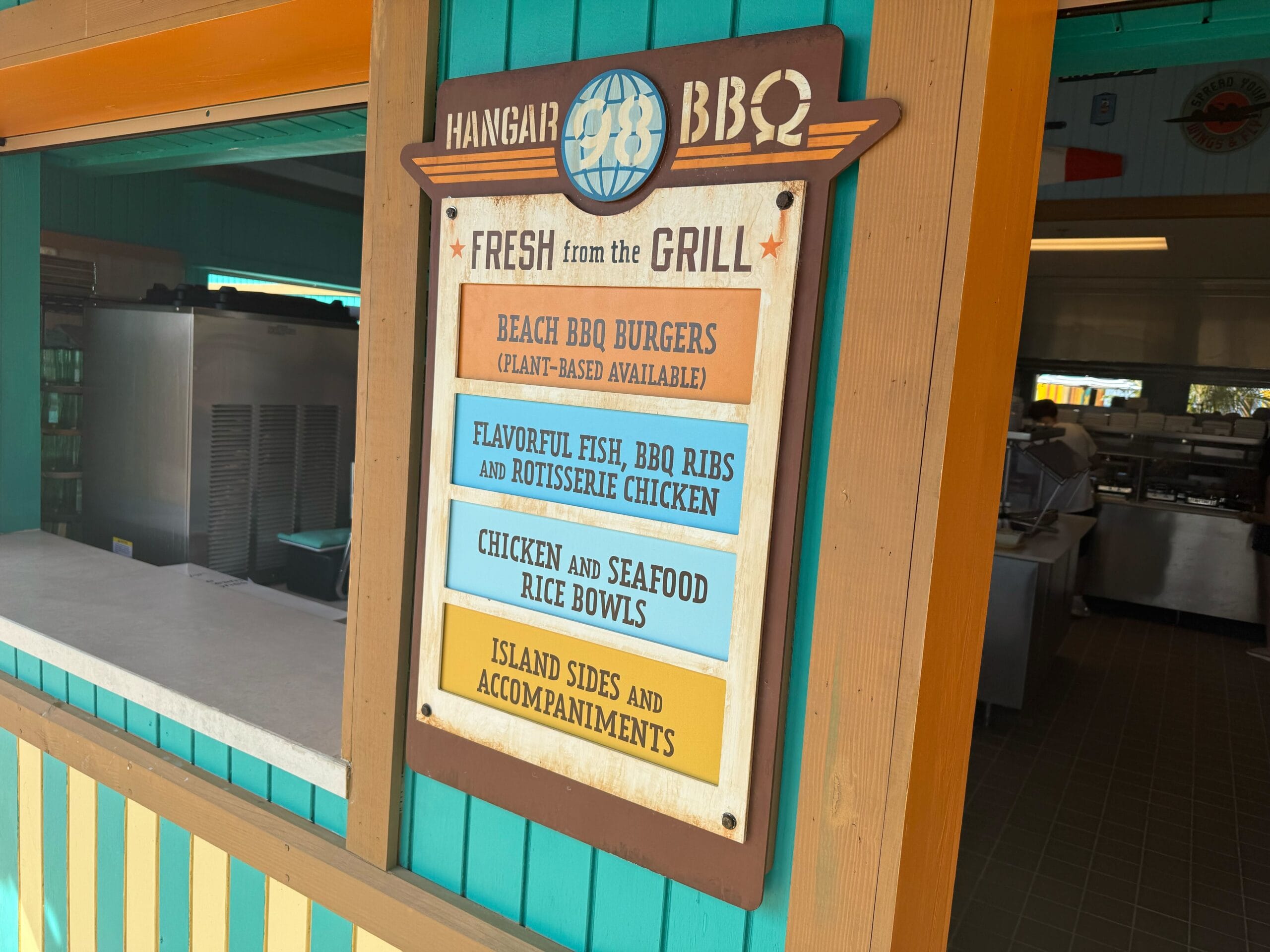 Hangar 98 BBQ serves the same staples as the former Serenity Bay BBQ and the island's other dining pavilions, Cookie's BBQ and Cookie's Too BBQ.