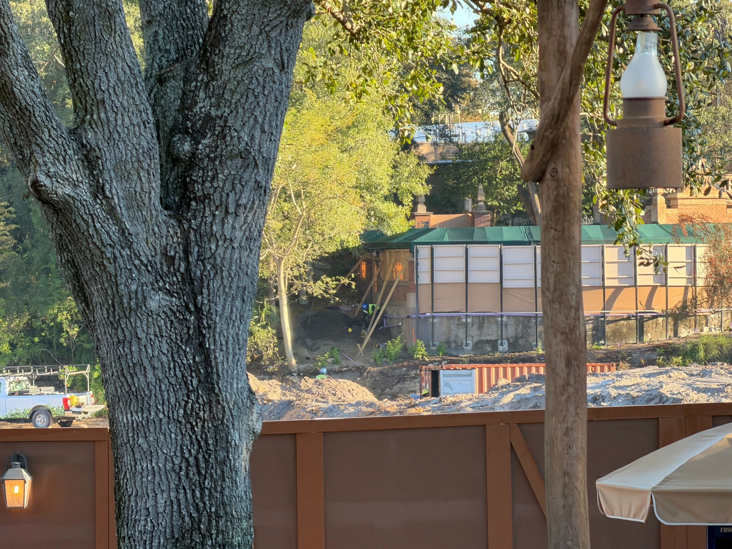 Construction walls also run the length of The Haunted Mansion's outdoor queue.