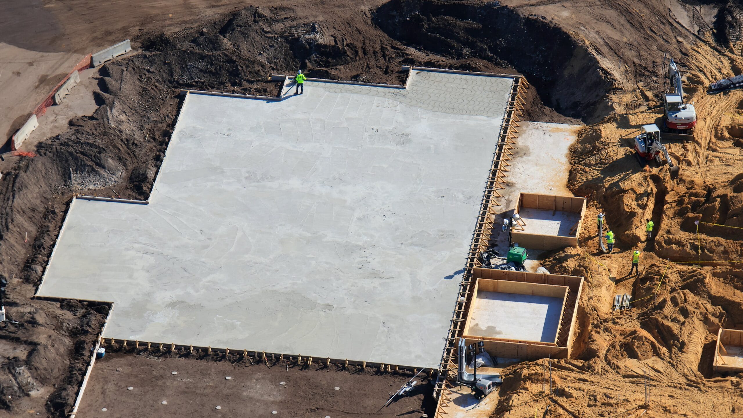 A large pad of concrete was recently cast for the Monstropolis roller coaster.
