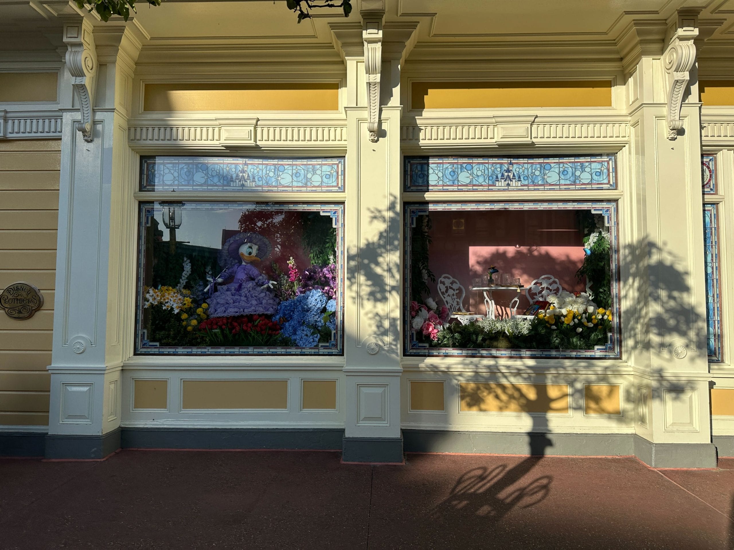 Magic Kingdom Springtime Window Display Features Daisy in Azalea Trail Maids Outfit