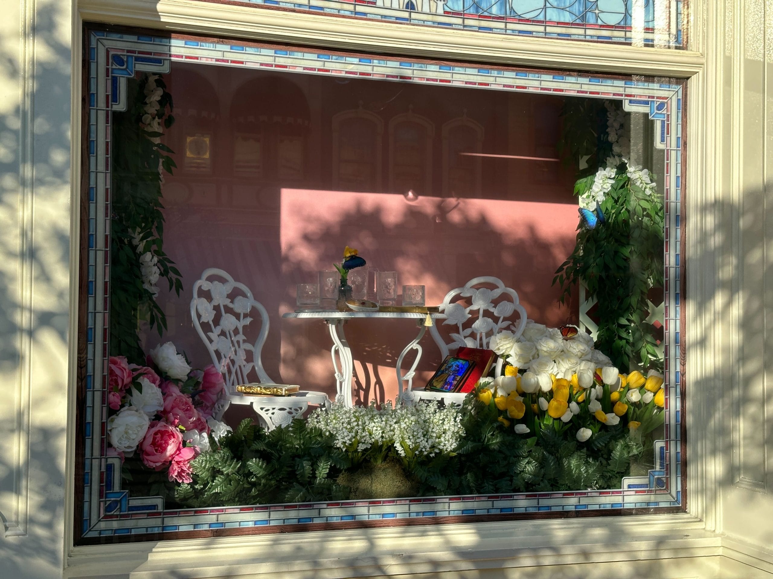 Magic Kingdom Springtime Window Display Features Daisy in Azalea Trail Maids Outfit